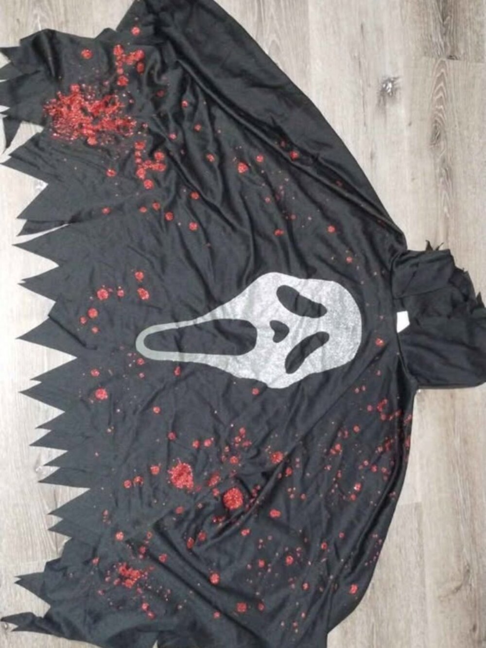 "One Size Fits Most" Never Used. Women's glitter Ghost Face Costume Poncho